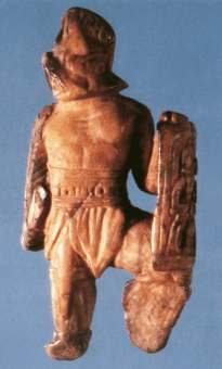 Bone figurine of a gladiator (a murmillo) from Lexden. From Köhne, E. + Ewigleben, C. (2000) 'Gladiators and Caesars' BMP: London
