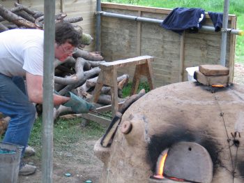 17. Filling the pots with glass.