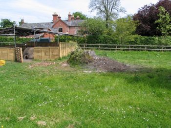 12. The re-sculpted mound covering the remains of the ash pits.