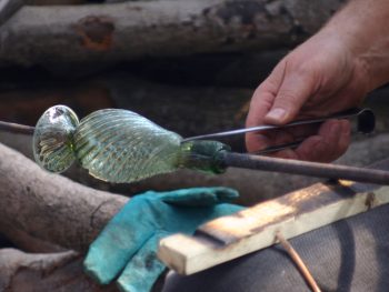 43. Cracking the vessel off the blowing iron.