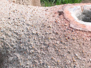 10. Erosion of the clay on the top of the furnace by the rain. Note the resistance of the fired area next to the top hole.