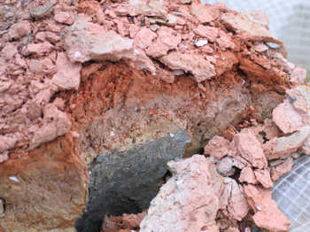 43. Detail of one of the lumps of daub left on the ground, showing attack by frost action.