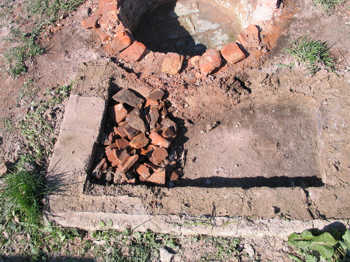 38. Demolishing the floor of the oven.