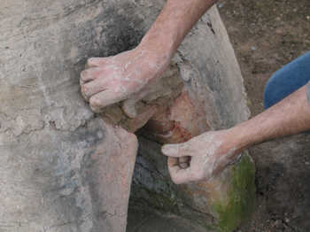 3. Repairing the holes with fresh daub.