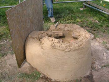 20. Using a board to check the alignment of the stoke hole entrance.