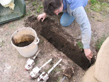 3. Digging the trench and removing the plastic milk bottles.