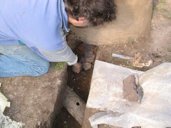 12. Filling the trench with clay.