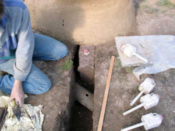 13. Filling the trench with clay.