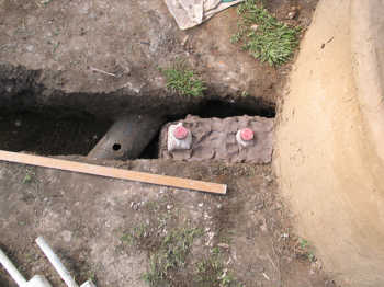 14. Filling the trench with clay.