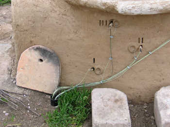20. The wires with the marver removed. Note the wires disappearing into a pipe in the ground.