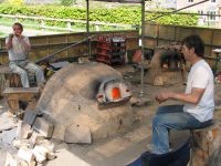 Blowing glass.