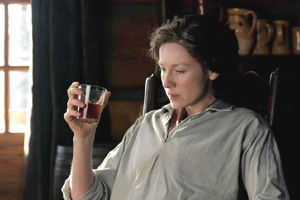 Claire relaxing with a tumbler of whisky