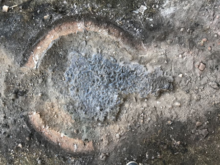 The cleaned furnace footprint showing the pool of leaked glass