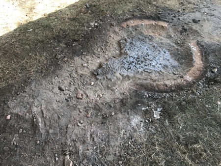 The cleaned furnace footprint showing the pool of leaked glass