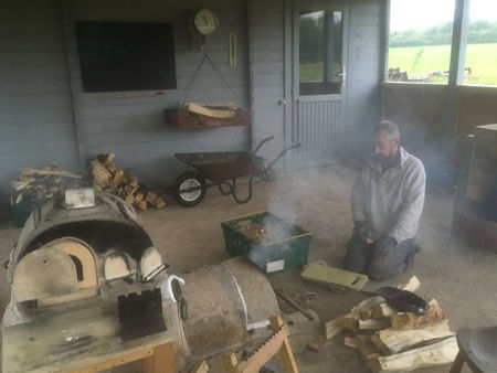 Firing Four: lighting the furnace in the morning using scraps of wood (Photo © Fiona Rashleigh)