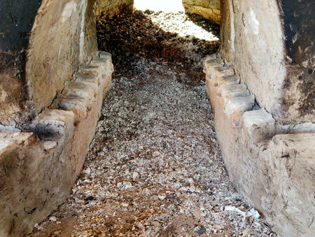 Firing Three: grey ash in the stoke hole giving way to red-brown ash in the firing chamber