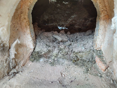 Greenish-coloured ash at the ash hole at the end of Firing Five