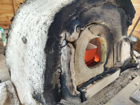 The right-hand side of the furnace, showing the damage around the gathering hole