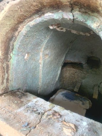 The left-hand side of the furnace, showing the damage around the gathering hole (Photo © Tracey Snape)