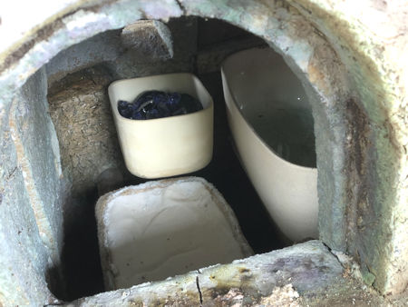 Setting two small square pots, one with cobalt blue glass in it (Photo © Fiona Rashleigh)