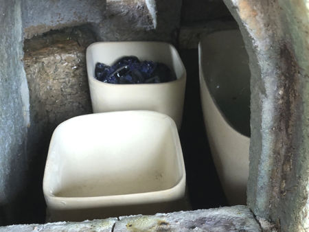 Setting two small square pots, one with cobalt blue glass in it (Photo © Fiona Rashleigh)