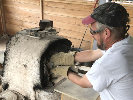 Setting the replacement pot in the furnace (Photo © Fiona Rashleigh)