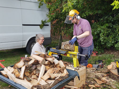 Fiona and Steve splitting wood