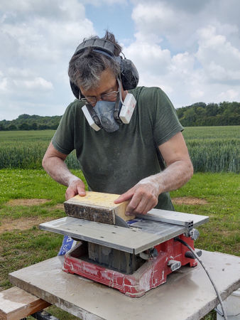 Mark cutting an arch brick