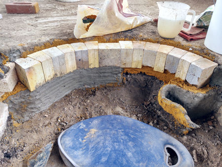 Repositioning the retaining wall directly under the bricks