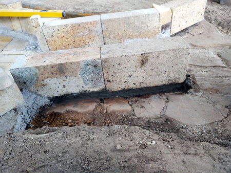 Showing the daub wall retaining the castable refractory concrete supporting the bricks