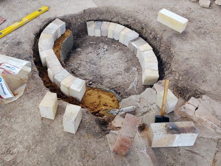 Laying the bricks on a layer of sand