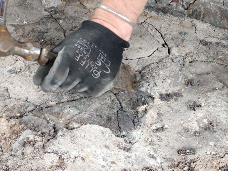 Chiselling the glass/ash away from the tiles