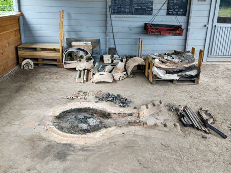 The firepit with the furnace superstructure in the background