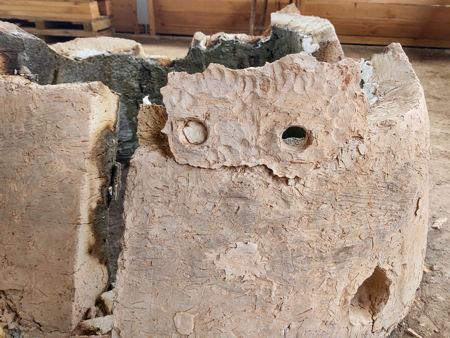 The back right-hand lower wall showing the additional daub that had supported the fire bars