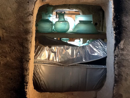 Annealed glass vessels and the aluminium box to try to isolate some vessels from the lehr atmosphere (Photo © Steve Wagstaff