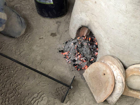 Hot charcoal and ash (Photo © Fiona Rashleigh)