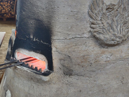 The crack on the right-hand side and the back of the furnace