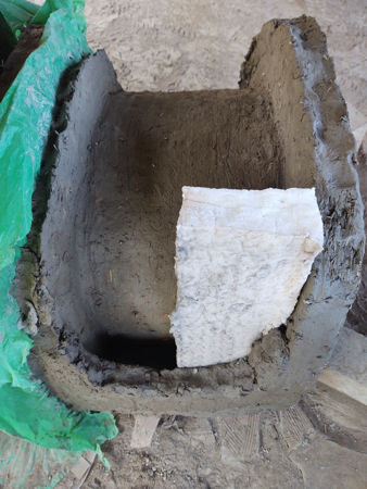 Encasing the ceramic fibre between the inner and outer walls of the tunnel