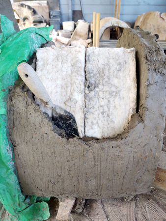 Encasing the ceramic fibre between the inner and outer walls of the tunnel