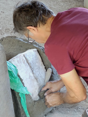 Encasing the ceramic fibre between the inner and outer walls of the tunnel