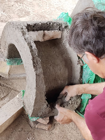 Encasing the ceramic fibre between the inner and outer walls of the tunnel