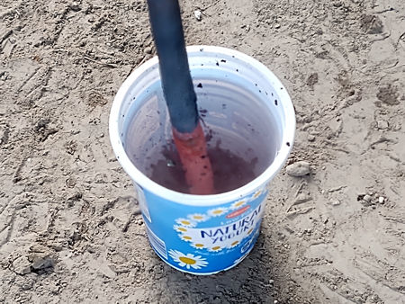 Plunging the copper tube into cold water to produce copper scale (oxide)