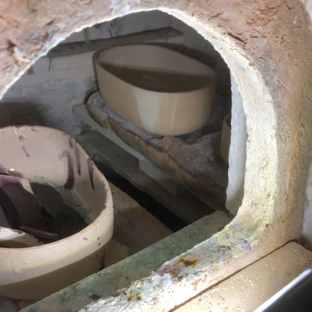 Broken pots, and shelf showing sand behind its retaining wall (Photo © Fiona Rashleigh)