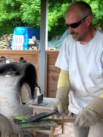 Putting away a flattened cylinder pane (Photo © Denise Allen)