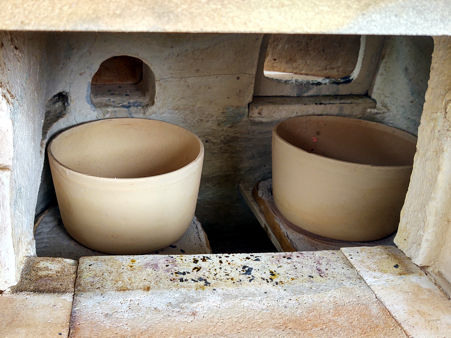 The two pots in position (after firing for two days)