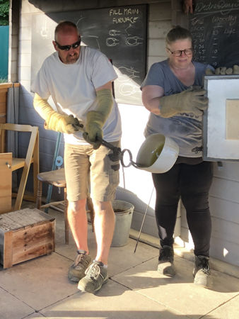 Replacing a pot into the furnace (Photo © Fiona Rashleigh)