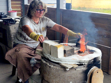 Beadmaking, with the furnace at about 1100°C