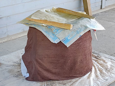 Covered with damp towels and plastic bags to prevent drying