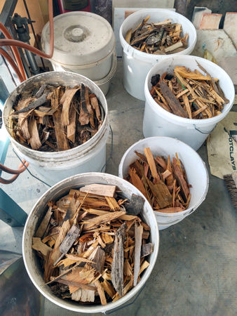 Buckets of splinters and offcuts drying for use in lighting the furnace.